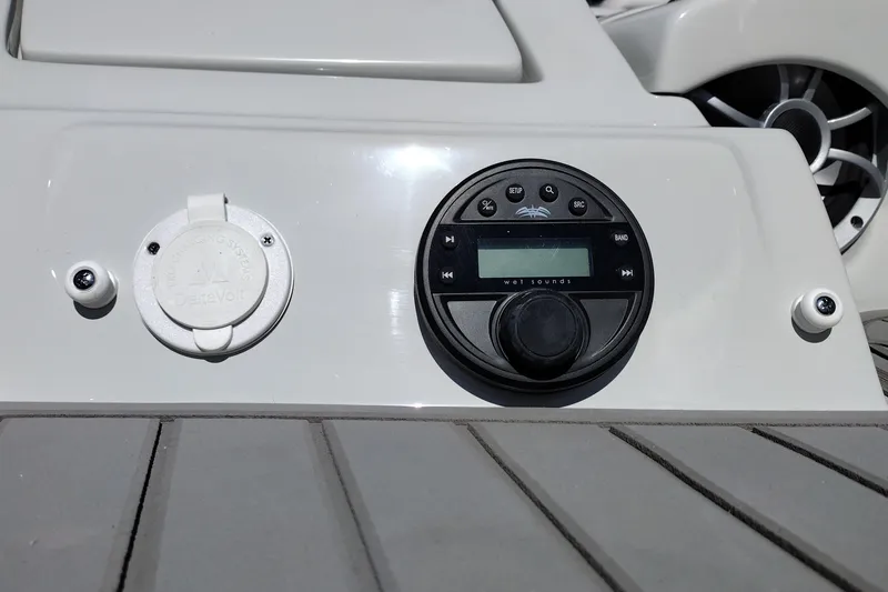 Slide: The Image of Control panel of 2026 Crownline 260 XSS boat with audio system and DeltaVolt charger. - 43