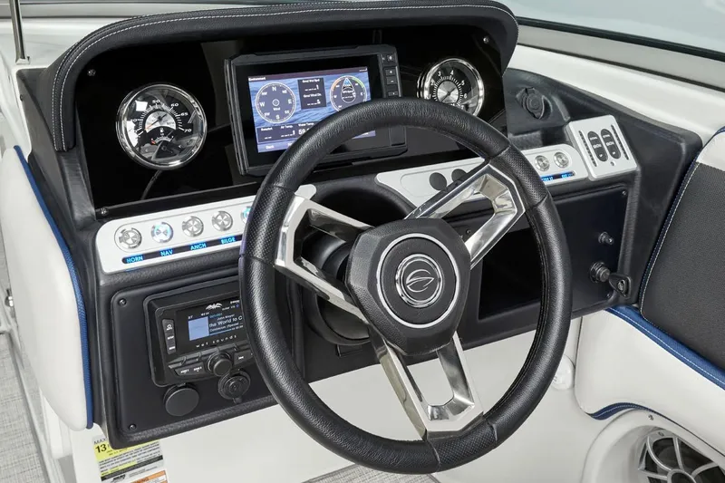 Slide: The Image of 2026 Crownline 260 XSS boat dashboard with steering wheel and control panel. - 9