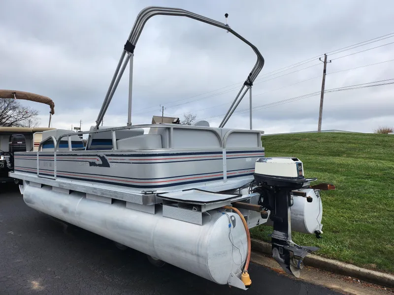 Slide: The Image of 1991 Grumman Fish N Fun 20' pontoon boat with outboard motor. - 3