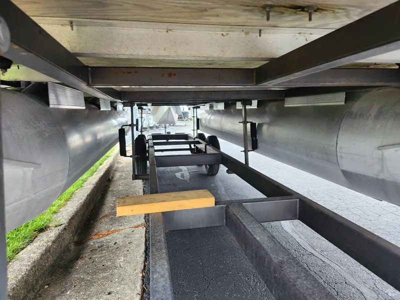 Slide: The Image of Underneath view of a 1991 Grumman Fish N Fun 20' boat on a trailer. - 7