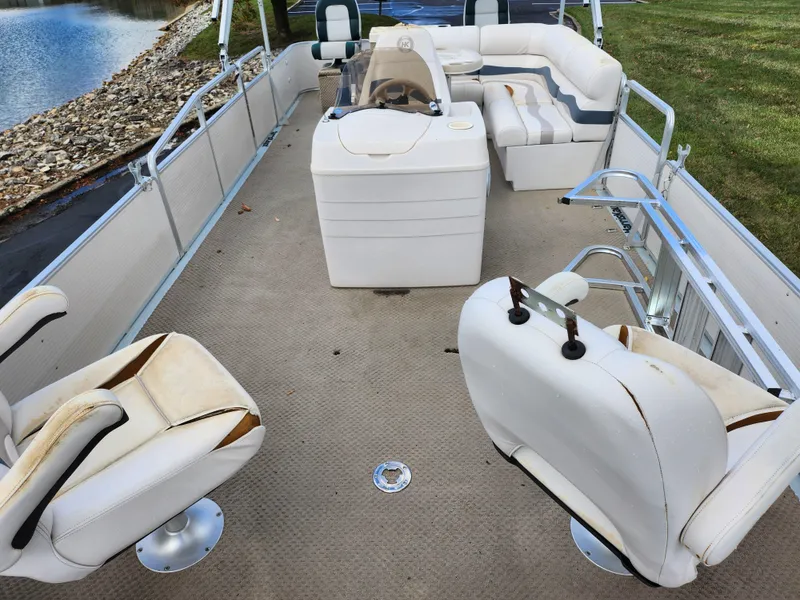 Slide: The Image of 2002 Harris FloteBote 220 Fisherman interior with seating and steering console. - 10