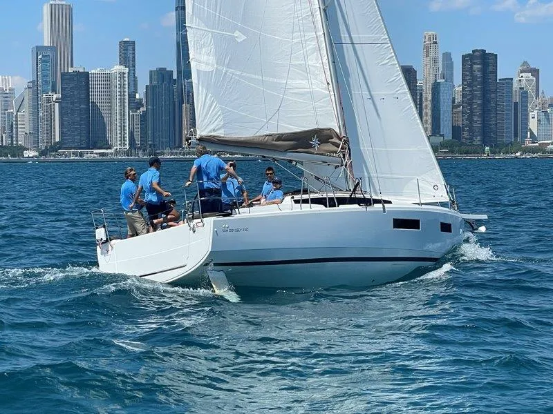 The Image of 2025 Jeanneau Sun Odyssey 350 sailing near city skyline on a sunny day. - 0