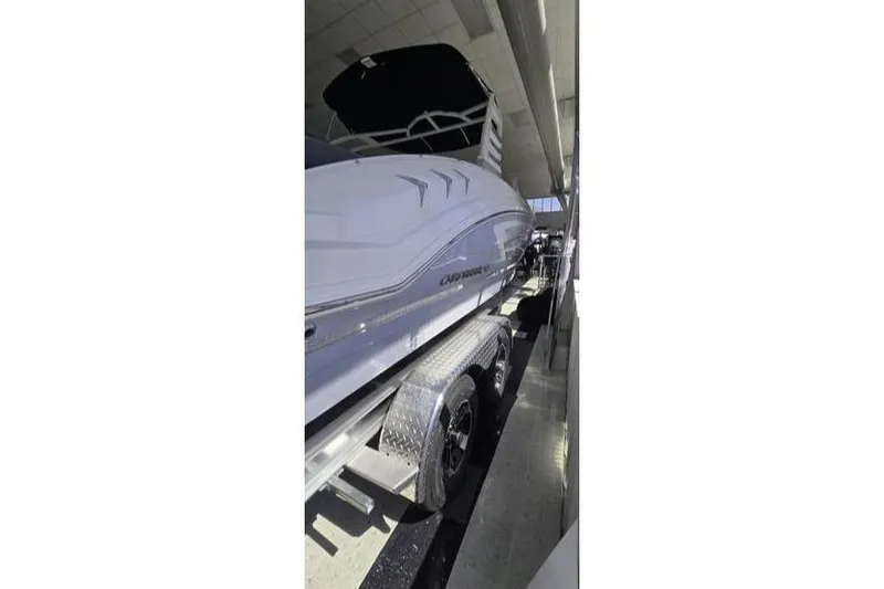 Slide: The Image of 2025 Chaparral 23 SSi OB boat on trailer in showroom. - 4