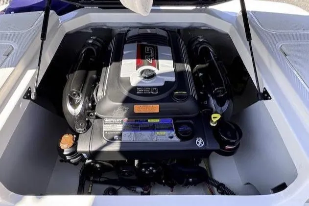Slide: The Image of 2025 Chaparral 21 SSi boat engine compartment with powerful Mercury engine. - 4
