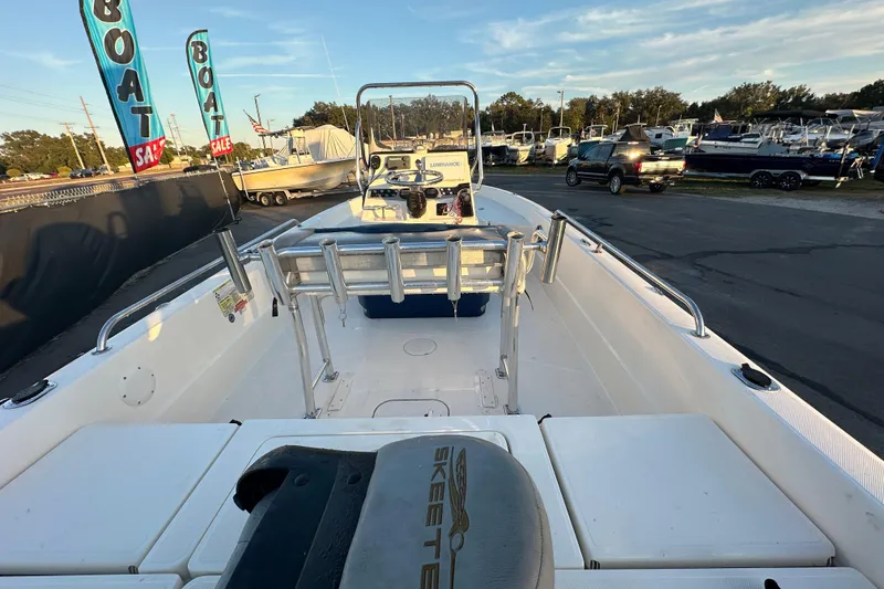 Slide: The Image of 2014 Skeeter SX2250 boat interior with seating and storage compartments. - 13
