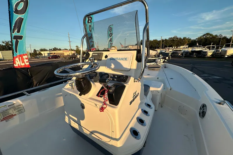 Slide: The Image of 2014 Skeeter SX2250 boat interior with seating and steering console. - 14