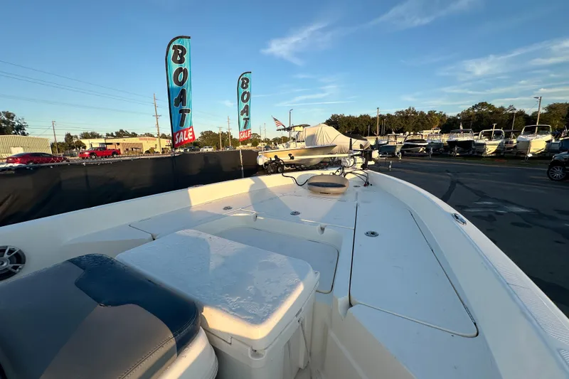 Slide: The Image of 2014 Skeeter SX2250 boat interior with seating and steering console. - 15