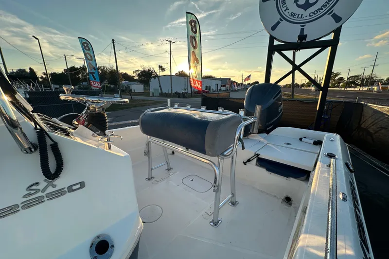 Slide: The Image of 2014 Skeeter SX2250 boat cockpit with steering wheel and navigation equipment. - 18