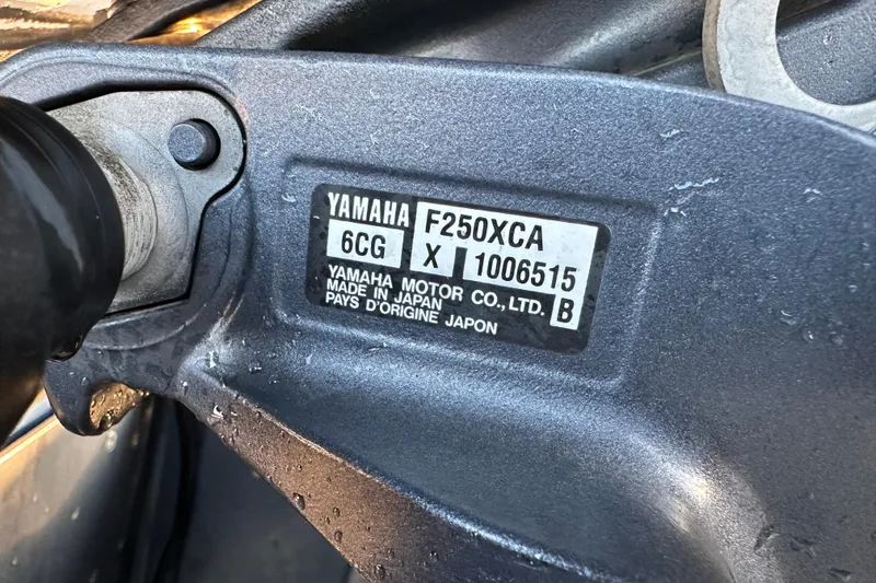 Slide: The Image of 2014 Skeeter SX2250 boat cockpit with steering wheel and navigation equipment. - 19