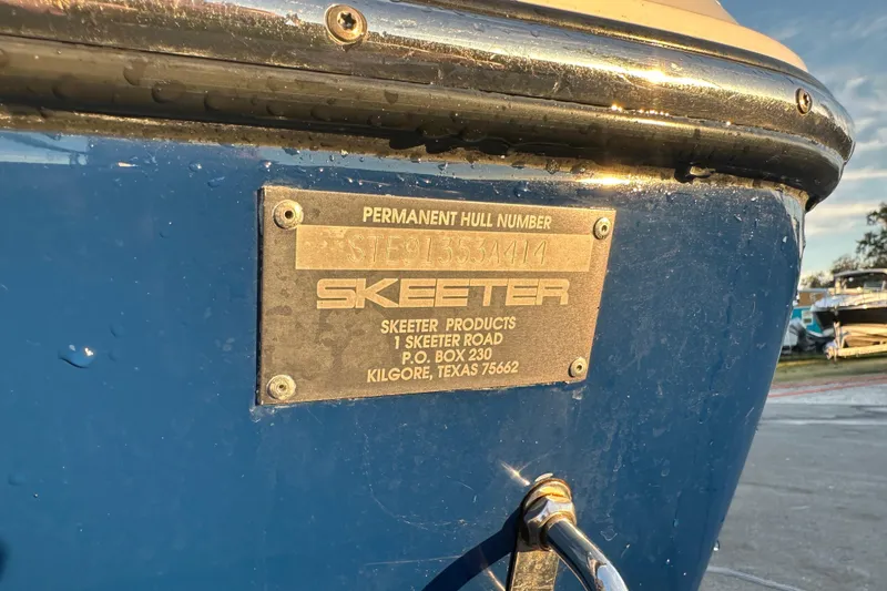 Slide: The Image of 2014 Skeeter SX2250 boat dashboard with Raymarine radio and Boss audio system. - 21