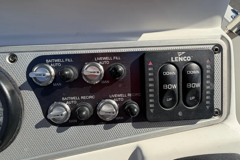 Slide: The Image of Control panel of a 2014 Skeeter SX2250 boat with Yamaha display and switches. - 22