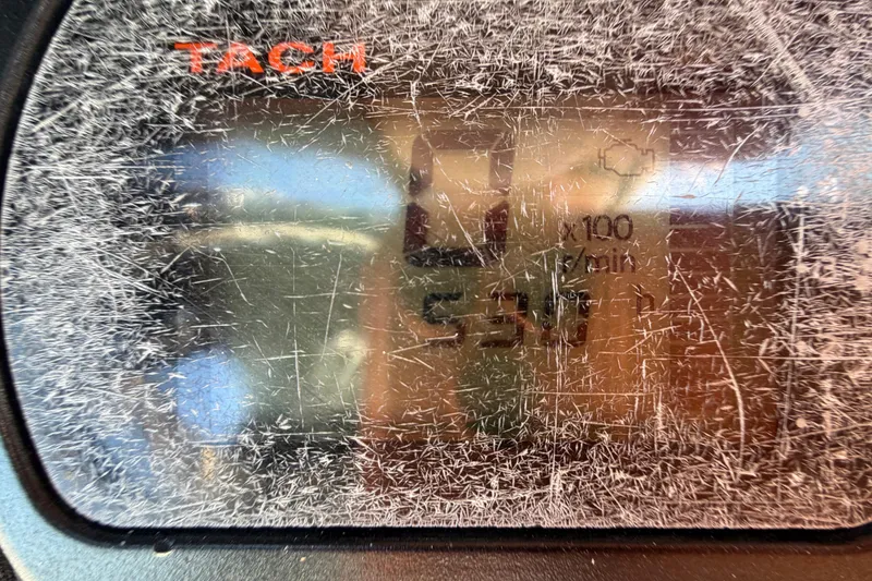 Slide: The Image of Control panel of a 2014 Skeeter SX2250 boat with switches and Lenco trim tabs. - 25