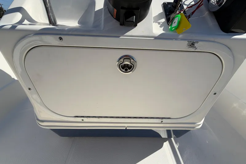 Slide: The Image of Control panel of a 2014 Skeeter SX2250 boat with throttle and ignition keys. - 26
