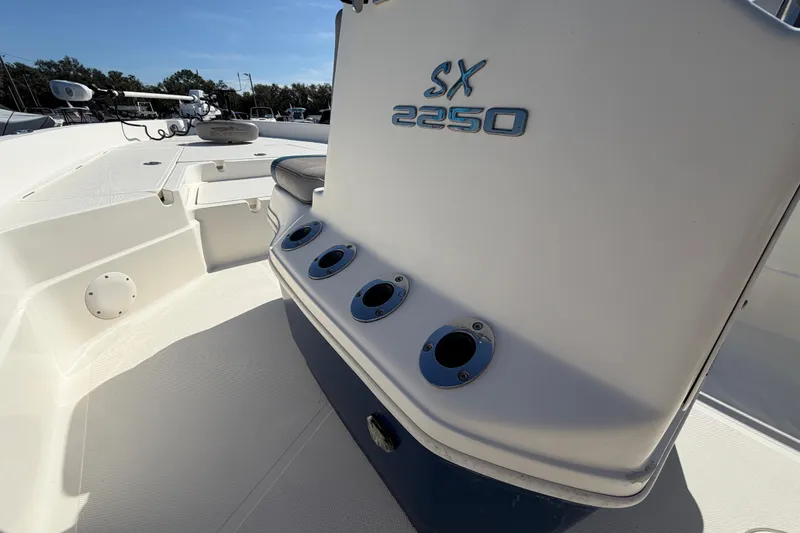 Slide: The Image of 2014 Skeeter SX2250 boat compartment with wiring and electrical components. - 29