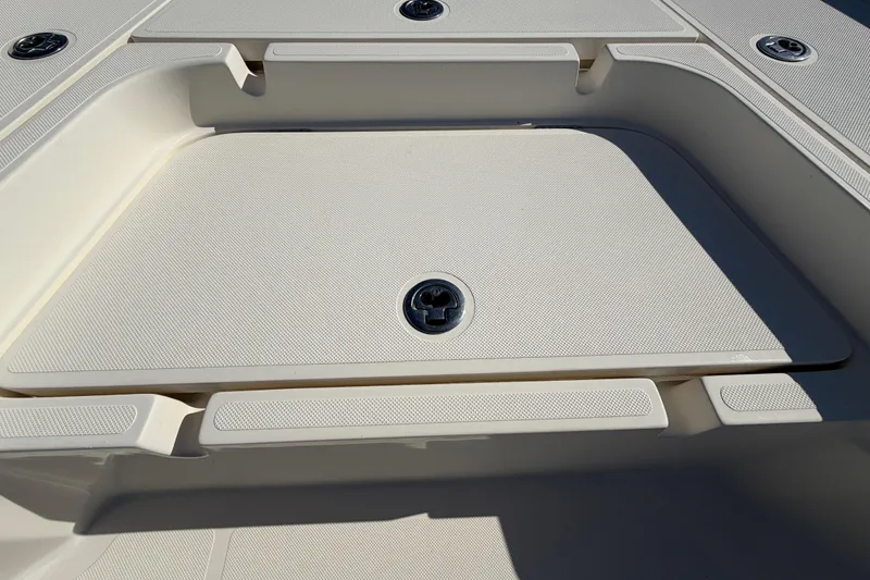 Slide: The Image of Open storage compartment on 2014 Skeeter SX2250 boat deck. - 34