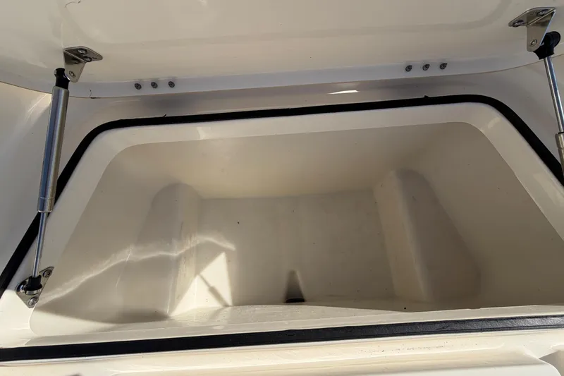 Slide: The Image of 2014 Skeeter SX2250 boat deck with storage compartment and latch. - 36