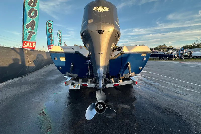 Slide: The Image of 2014 Skeeter SX2250 boat with Yamaha 250 V6 engine, displayed outdoors. - 4