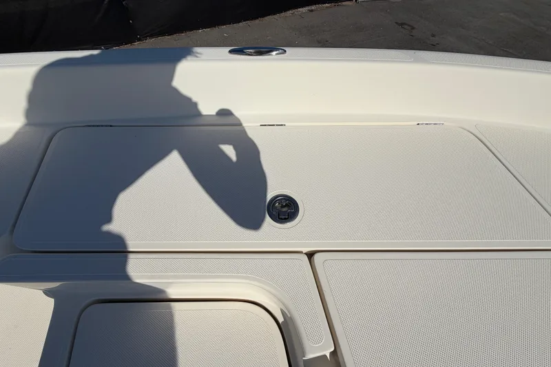 Slide: The Image of Open storage compartment on a 2014 Skeeter SX2250 boat deck. - 43