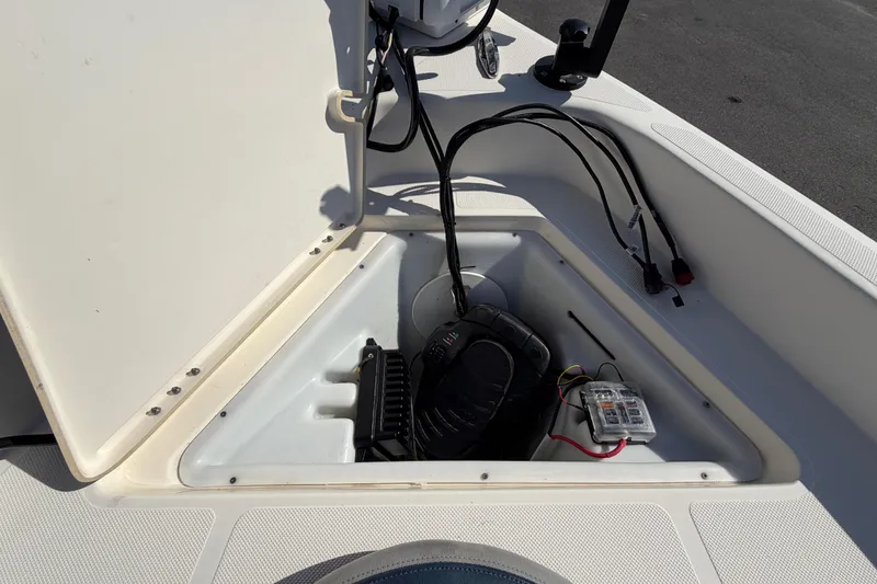 Slide: The Image of 2014 Skeeter SX2250 boat deck with storage compartments and trolling motor. - 48