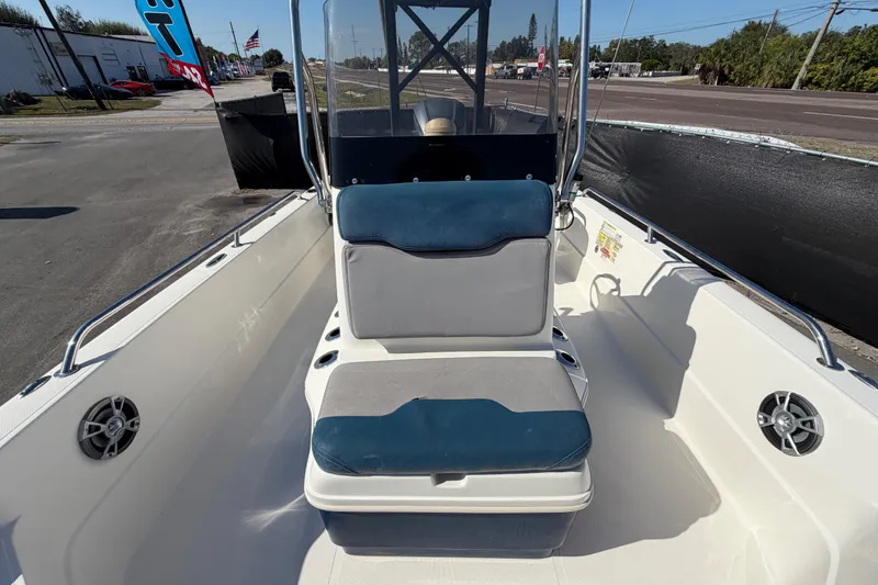 Slide: The Image of 2014 Skeeter SX2250 boat seat with blue and gray upholstery, outdoor setting. - 55