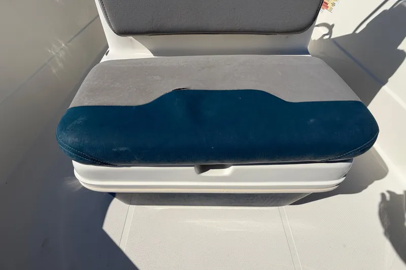 Slide: The Image of 2014 Skeeter SX2250 boat interior with open hatch and visible wiring. - 56