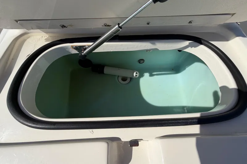 Slide: The Image of 2014 Skeeter SX2250 boat console with steering wheel and controls. - 58