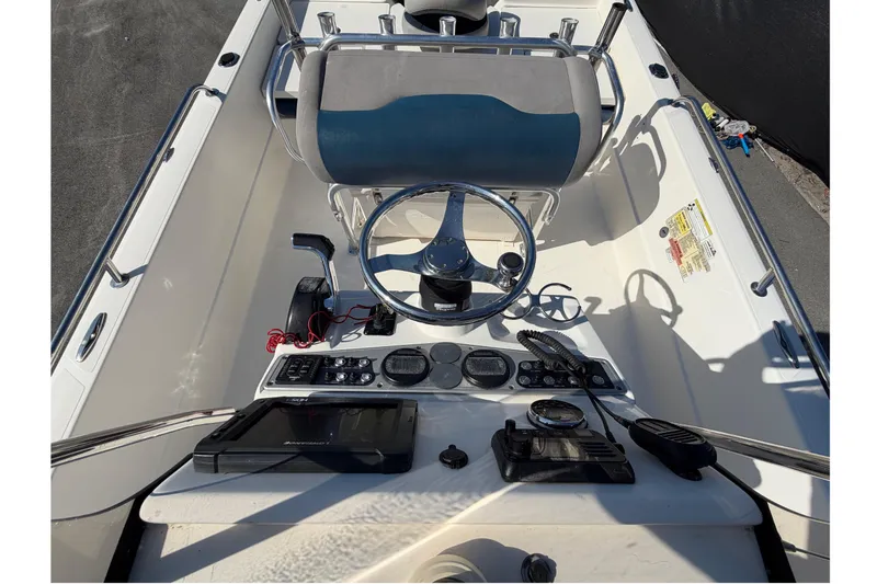 Slide: The Image of 2014 Skeeter SX2250 boat cockpit with steering wheel and controls. - 59