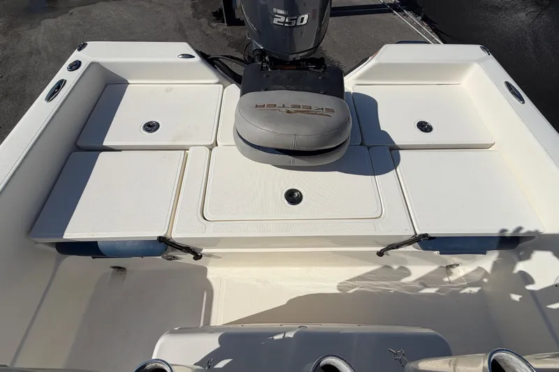 Slide: The Image of 2014 Skeeter SX2250 boat seat with blue and gray upholstery. - 65