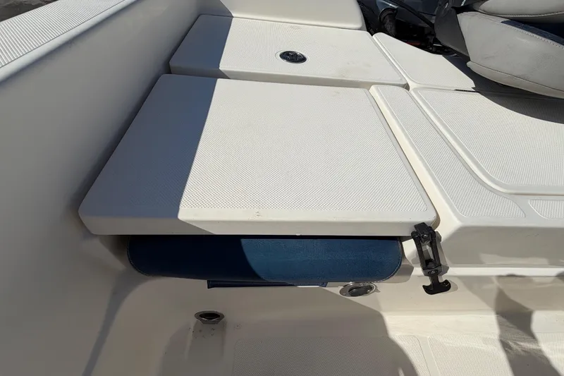 Slide: The Image of 2014 Skeeter SX2250 boat interior with open storage compartment and seating. - 67