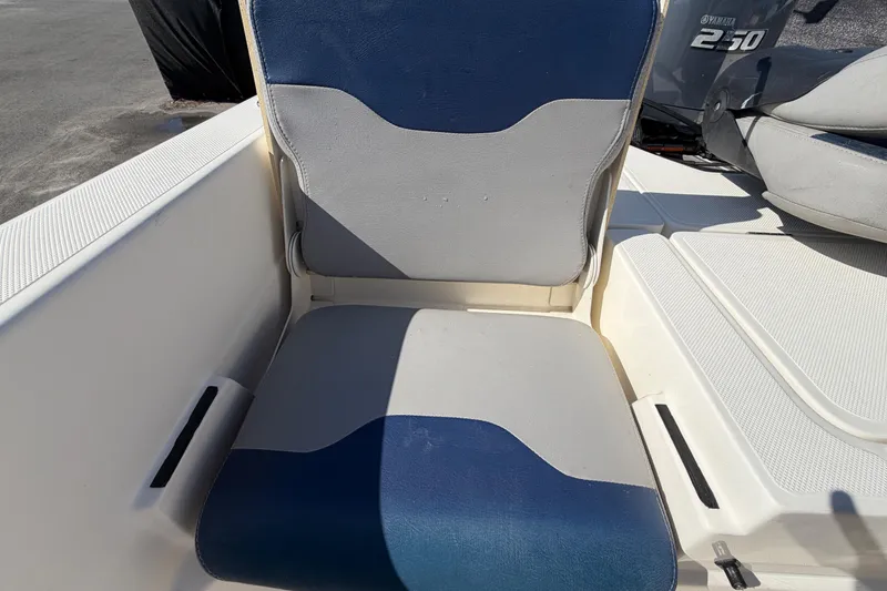 Slide: The Image of Open storage compartment on a 2014 Skeeter SX2250 boat. - 68