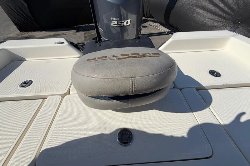 Slide: The Image of Empty storage compartment in a 2014 Skeeter SX2250 boat. - 69