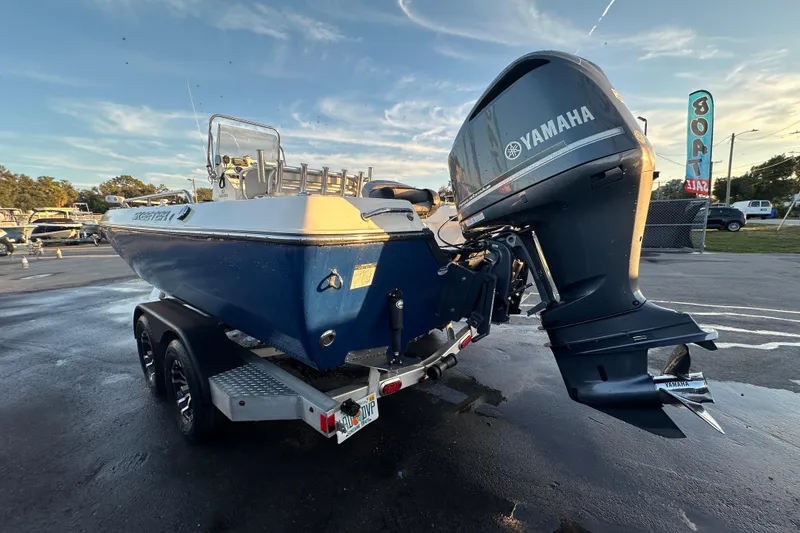 Slide: The Image of 2014 Skeeter SX2250 boat with Yamaha outboard motor, parked on a trailer. - 7