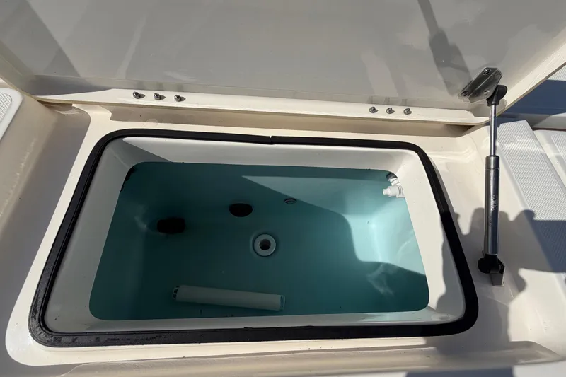 Slide: The Image of 2014 Skeeter SX2250 boat deck with storage compartments and control panel. - 75