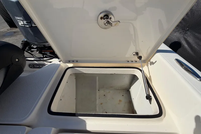 Slide: The Image of 2014 Skeeter SX2250 boat interior with seating and storage compartments. - 80