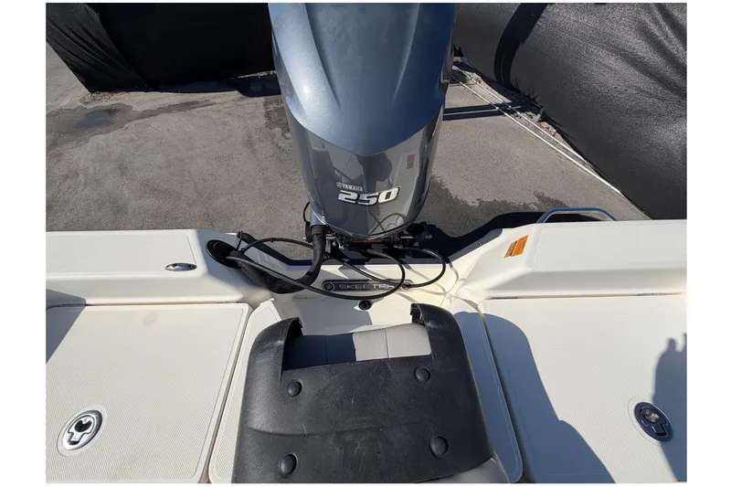 Slide: The Image of Open storage compartment on 2014 Skeeter SX2250 boat, showcasing interior details. - 82