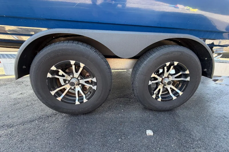 Slide: The Image of 2014 Skeeter SX2250 boat storage compartment with textured lid and latch. - 84