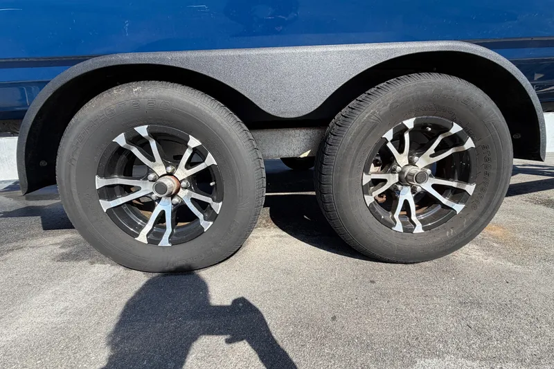 Slide: The Image of Open storage compartment on a 2014 Skeeter SX2250 boat, containing ropes. - 85