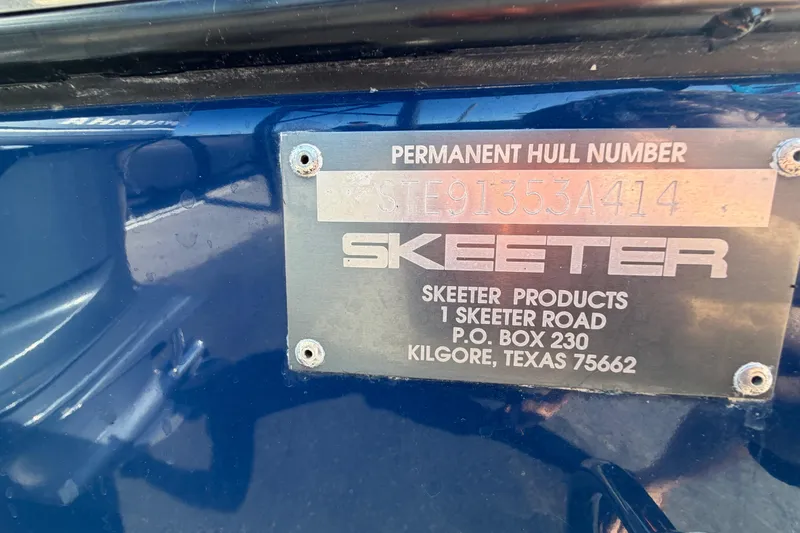 Slide: The Image of Open storage compartment in 2014 Skeeter SX2250 boat with ropes inside. - 86