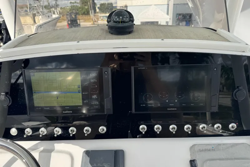 Slide: The Image of 2020 Sportsman Heritage 231 Center Console dashboard with Garmin navigation displays. - 11