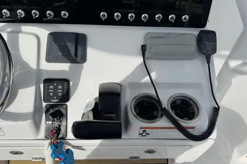 Slide: The Image of 2020 Sportsman Heritage 231 Center Console dashboard with controls and accessories. - 17