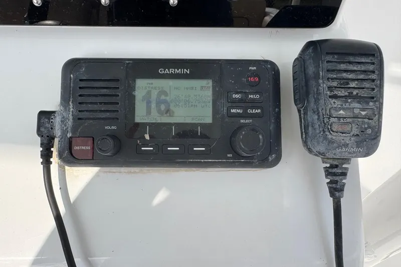 Slide: The Image of Garmin marine radio on 2020 Sportsman Heritage 231 Center Console boat. - 19