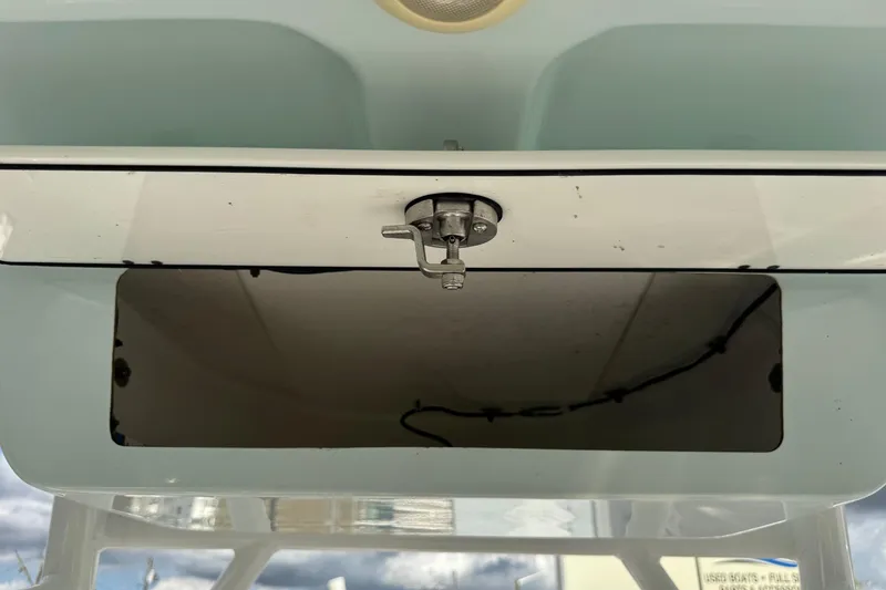 Slide: The Image of 2020 Sportsman Heritage 231 Center Console storage compartment with latch, open view. - 22