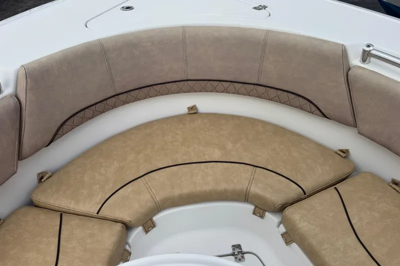 Slide: The Image of 2020 Sportsman Heritage 231 Center Console boat with tan cushioned seating. - 29