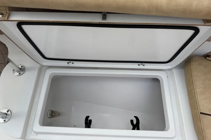 Slide: The Image of Open storage compartment on 2020 Sportsman Heritage 231 Center Console boat. - 32