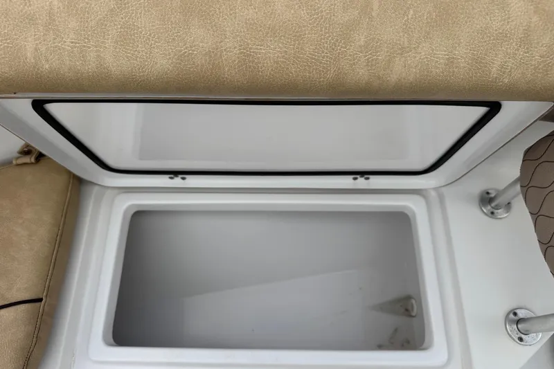 Slide: The Image of Open storage compartment on 2020 Sportsman Heritage 231 Center Console boat. - 33