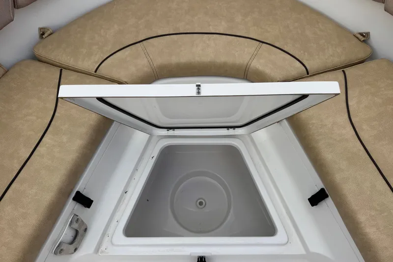 Slide: The Image of Open storage compartment on 2020 Sportsman Heritage 231 Center Console boat. - 34