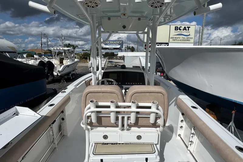 Slide: The Image of 2020 Sportsman Heritage 231 Center Console boat interior at a dealership. - 4