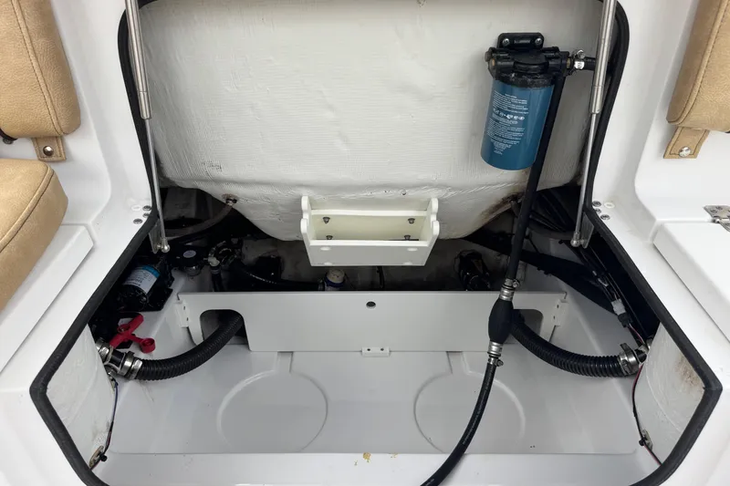 Slide: The Image of 2020 Sportsman Heritage 231 Center Console boat interior with visible engine components. - 44