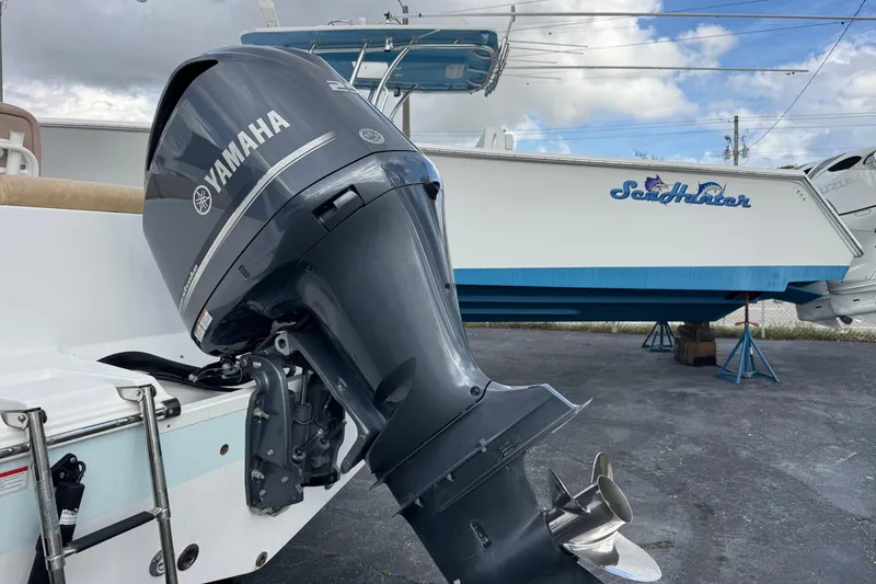 Slide: The Image of 2020 Sportsman Heritage 231 Center Console with Yamaha outboard motor, parked on a lot. - 48