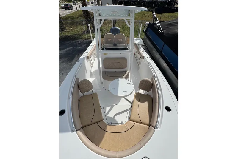 Slide: The Image of 2020 Sportsman Heritage 231 Center Console boat with tan seating and white deck. - 7